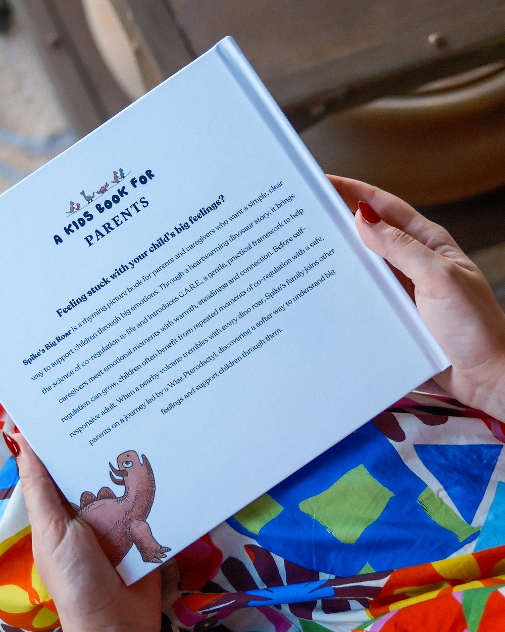 A child reading the illustrated pages of Spike's Big Roar